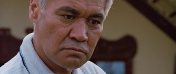 Movie still from “Whale Rider” (2002), directed by Niki Caro – An older man is looking at the camera; Close Up shot, Low angle