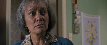 Movie still from “Whale Rider” (2002), directed by Niki Caro – An older woman is looking at the camera; Close Up shot, Low angle