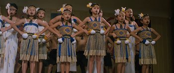 Movie still from “Whale Rider” (2002), directed by Niki Caro – A group of young people in native dress performing; Medium shot, High angle
