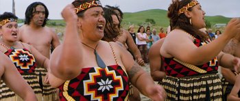 Movie still from “Whale Rider” (2002), directed by Niki Caro – A group of women in traditional dress dancing; Medium shot, Over the shoulder angle