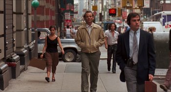 Movie still from “What About Bob?” (1991), directed by Frank Oz – A group of people walking down a street; Wide shot, Over the shoulder angle