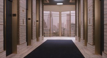 Movie still from “What About Bob?” (1991), directed by Frank Oz – A hallway leading to a room with a view of a city; Extreme Wide shot, High angle