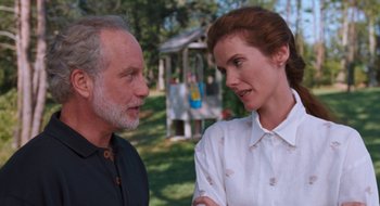 Movie still from “What About Bob?” (1991), directed by Frank Oz – An older man and a younger woman talking in a park; Medium shot, Over the shoulder angle