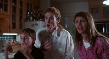 Movie still from “What About Bob?” (1991), directed by Frank Oz – A group of people that are in a room; Medium shot, Low angle