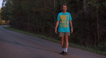 Movie still from “What About Bob?” (1991), directed by Frank Oz – A man is walking down the street at night; Wide shot, Low angle