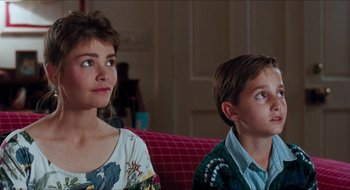 Movie still from “What About Bob?” (1991), directed by Frank Oz – A woman and a young boy sitting next to each other on a couch; Close Up shot, Over the shoulder angle