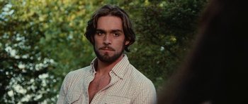 Movie still from “What Have You Done to Solange?” (1972), directed by Massimo Dallamano – A person wearing a shirt; Close Up shot, Over the shoulder angle