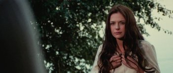 Movie still from “What Have You Done to Solange?” (1972), directed by Massimo Dallamano – A beautiful young lady standing in front of a tree; Close Up shot, Over the shoulder angle