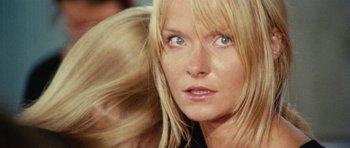 Movie still from “What Have You Done to Solange?” (1972), directed by Massimo Dallamano – A woman's face with long blonde hair; Close Up shot, Low angle