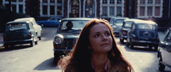 Movie still from “What Have You Done to Solange?” (1972), directed by Massimo Dallamano – A woman standing on the side of the road near a car; Close Up shot, Low angle