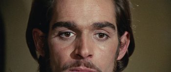 Movie still from “What Have You Done to Solange?” (1972), directed by Massimo Dallamano – A person's face with brown eyes; Extreme Close Up shot, Overhead angle