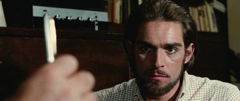 Movie still from “What Have You Done to Solange?” (1972), directed by Massimo Dallamano – A person with a beard; Close Up shot, Over the shoulder angle