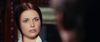 Movie still from “What Have You Done to Solange?” (1972), directed by Massimo Dallamano – A woman's face in front of a blurry background; Close Up shot, Over the shoulder angle