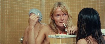 Movie still from “What Have You Done to Solange?” (1972), directed by Massimo Dallamano – A woman brushing her teeth in a bathroom; Close Up shot, High angle