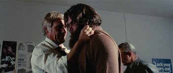 Movie still from “What Have You Done to Solange?” (1972), directed by Massimo Dallamano – A man with long hair and a long beard standing next to another man with long hair; Close Up shot, Low angle