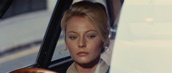 Movie still from “What Have You Done to Solange?” (1972), directed by Massimo Dallamano – A person wearing a white shirt; Close Up shot, Over the shoulder angle