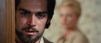 Movie still from “What Have You Done to Solange?” (1972), directed by Massimo Dallamano – A person with a beard; Close Up shot, Over the shoulder angle