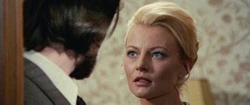 Movie still from “What Have You Done to Solange?” (1972), directed by Massimo Dallamano – A woman with blonde hair and blue eyes looking at a man with blonde hair and blue eyes; Close Up shot, Over the shoulder angle