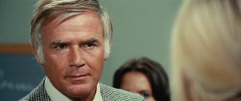 Movie still from “What Have You Done to Solange?” (1972), directed by Massimo Dallamano – An older man and a young woman are looking at the camera; Close Up shot, Over the shoulder angle