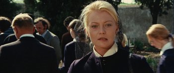 Movie still from “What Have You Done to Solange?” (1972), directed by Massimo Dallamano – A person wearing a black jacket; Close Up shot, Over the shoulder angle
