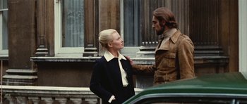 Movie still from “What Have You Done to Solange?” (1972), directed by Massimo Dallamano – A man and a woman standing next to each other on the street; Medium shot, Low angle