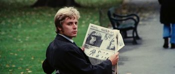 Movie still from “What Have You Done to Solange?” (1972), directed by Massimo Dallamano – A man holding a newspaper in his hands; Close Up shot, Low angle