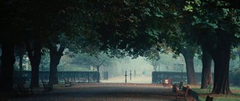 Movie still from “What Have You Done to Solange?” (1972), directed by Massimo Dallamano – People walking on a path in a park on a foggy day; Extreme Wide shot, High angle