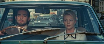 Movie still from “What Have You Done to Solange?” (1972), directed by Massimo Dallamano – A woman sitting in the driver's seat of a car; Medium shot, Over the shoulder angle