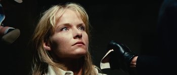 Movie still from “What Have You Done to Solange?” (1972), directed by Massimo Dallamano – A woman holding a pair of scissors in her hand; Close Up shot, Low angle