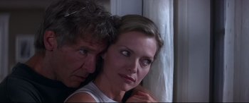 Movie still from “What Lies Beneath” (2000), directed by Robert Zemeckis – A man and a woman leaning against a wall; Close Up shot, Low angle