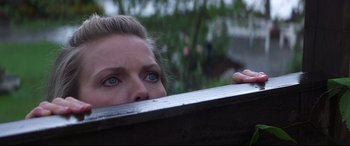 Movie still from “What Lies Beneath” (2000), directed by Robert Zemeckis – A person with blue eyes looking over a bench; Close Up shot, Low angle