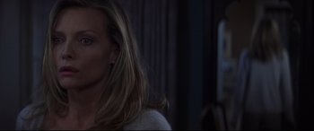 Movie still from “What Lies Beneath” (2000), directed by Robert Zemeckis – A person wearing a white shirt; Close Up shot, Over the shoulder angle