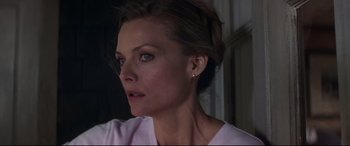 Movie still from “What Lies Beneath” (2000), directed by Robert Zemeckis – A person wearing a pink shirt; Close Up shot, Over the shoulder angle