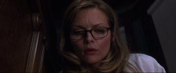 Movie still from “What Lies Beneath” (2000), directed by Robert Zemeckis – A person wearing glasses; Close Up shot, Low angle