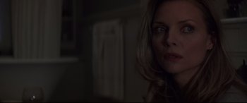 Movie still from “What Lies Beneath” (2000), directed by Robert Zemeckis – A person in a dark room; Close Up shot, Over the shoulder angle