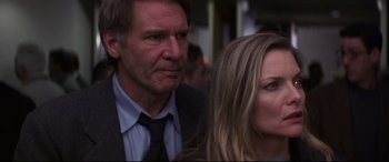 Movie still from “What Lies Beneath” (2000), directed by Robert Zemeckis – A man and a woman standing next to each other; Close Up shot, Low angle