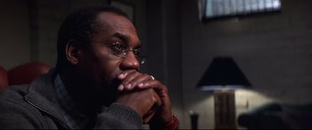 Movie still from “What Lies Beneath” (2000), directed by Robert Zemeckis – A person with his hand on his chin; Close Up shot, Over the shoulder angle