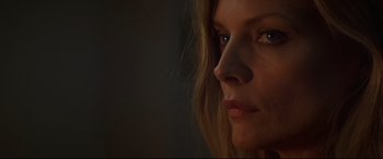 Movie still from “What Lies Beneath” (2000), directed by Robert Zemeckis – A woman's face in the dark; Close Up shot, Over the shoulder angle