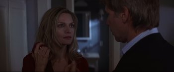 Movie still from “What Lies Beneath” (2000), directed by Robert Zemeckis – A man and a woman looking at one another; Close Up shot, Over the shoulder angle
