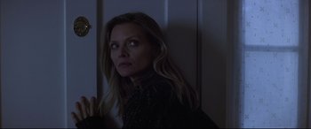 Movie still from “What Lies Beneath” (2000), directed by Robert Zemeckis – A woman standing next to a wall in a dark room; Close Up shot, Low angle