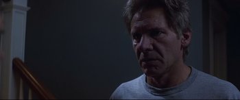 Movie still from “What Lies Beneath” (2000), directed by Robert Zemeckis – An older man is looking at the camera; Close Up shot, Low angle