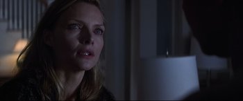 Movie still from “What Lies Beneath” (2000), directed by Robert Zemeckis – A person looking at the camera; Close Up shot, Over the shoulder angle