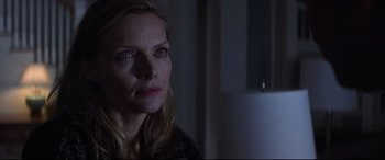 Movie still from “What Lies Beneath” (2000), directed by Robert Zemeckis – A person looking at the camera; Close Up shot, Over the shoulder angle