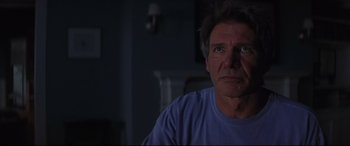 Movie still from “What Lies Beneath” (2000), directed by Robert Zemeckis – A person sitting in a room; Close Up shot, Over the shoulder angle