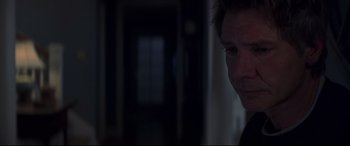 Movie still from “What Lies Beneath” (2000), directed by Robert Zemeckis – A person in a dark room; Close Up shot, Over the shoulder angle