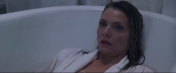 Movie still from “What Lies Beneath” (2000), directed by Robert Zemeckis – A person sitting in a chair; Close Up shot, High angle
