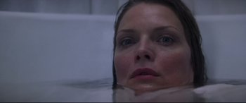Movie still from “What Lies Beneath” (2000), directed by Robert Zemeckis – A person in a body of water; Close Up shot, Overhead angle