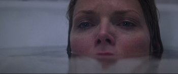 Movie still from “What Lies Beneath” (2000), directed by Robert Zemeckis – A woman's face in a body of water; Close Up shot, Overhead angle