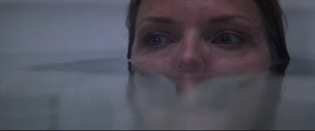 Movie still from “What Lies Beneath” (2000), directed by Robert Zemeckis – A woman's face in the fog; Extreme Close Up shot, Overhead angle