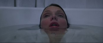 Movie still from “What Lies Beneath” (2000), directed by Robert Zemeckis – A woman in the water looking up at the camera; Close Up shot, Overhead angle